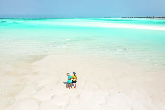 Framed Print : Cheerful man and woman embracing on idyllic tropical beach, overhead view, Nungwi, Zanzibar, Tanzania, East Africa, Africa Framed Print : Cheerful man and woman embracing on idyllic tropical beach, overhead view, Nungwi, Zanzibar, Tanzania, East Africa, Africa