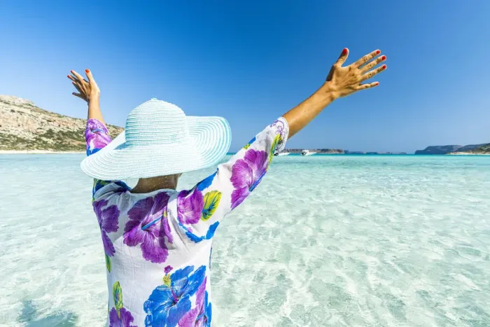 Framed Print : Cheerful woman with arms raised sunbathing in the clear sea, Crete, Greek Islands, Greece Framed Print : Cheerful woman with arms raised sunbathing in the clear sea, Crete, Greek Islands, Greece