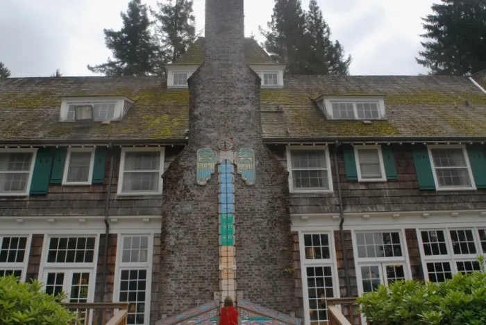 Framed Print : Child checking level of rain gauge at Lake Quinault Lodge