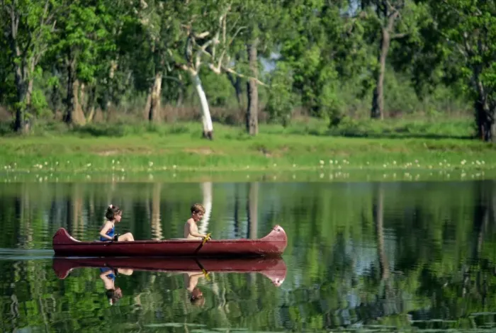 Framed Print : Children canoeing in Annaburroo Billabong at Mary River Crossing near the Arnhem Highway Framed Print : Children canoeing in Annaburroo Billabong at Mary River Crossing near the Arnhem Highway