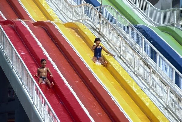 Children on the water chute of the Big Splash Aquatic Disneyland