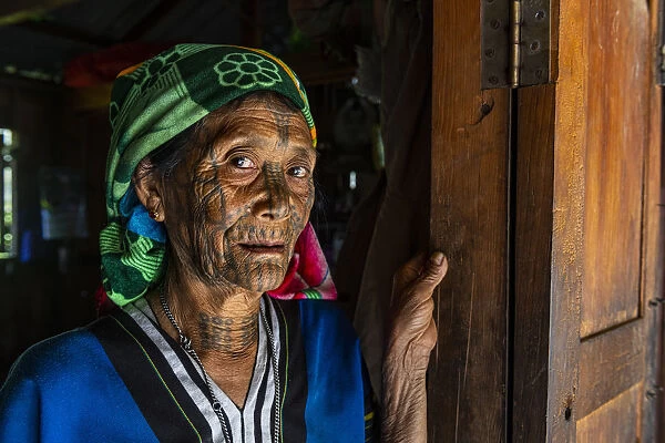 Chin woman with spiderweb tattoo, Mindat, Chin state, Myanmar (Burma), Asia