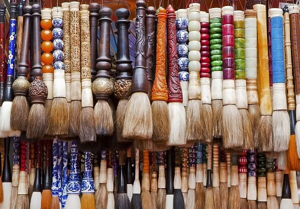 Chinese calligraphy brushes with colorful handcarved handles of stone and wood