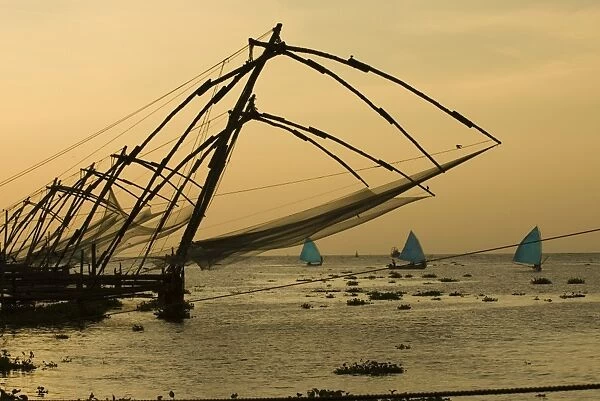 Chinese fishing nets at sunset, Kochi (Cochin), Kerala, India, Asia