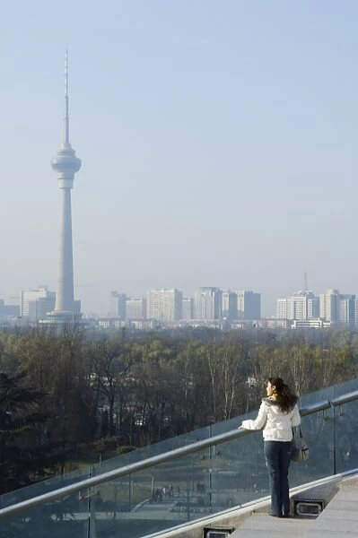 A Chinese girl in front of The CCTV Tower (China Central Television), Beijing