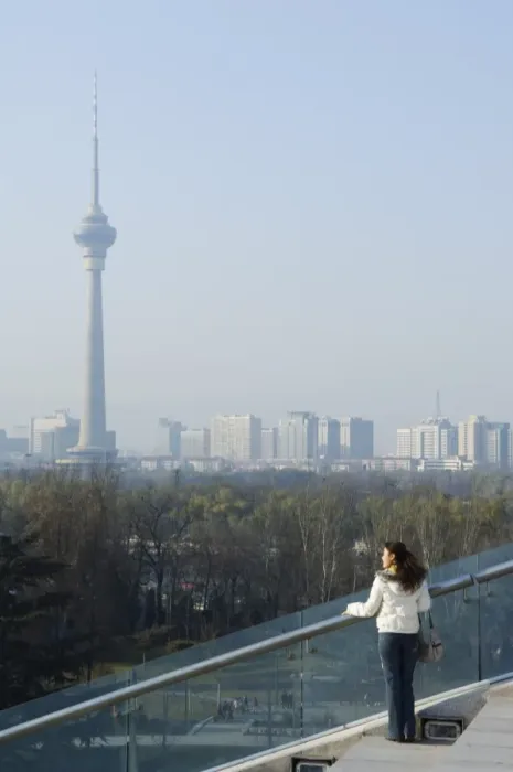 Framed Print : A Chinese girl in front of The CCTV Tower (China Central Television), Beijing Framed Print : A Chinese girl in front of The CCTV Tower (China Central Television), Beijing