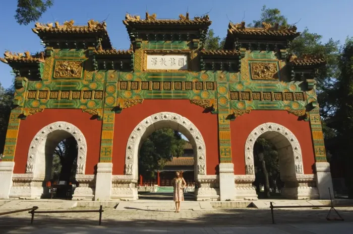 Framed Print : Chinese girl under a glazed archway at the Confucius Temple Imperial College built in 1306 by the grandson of Kublai Khan administering the official Confucian examination system, Beijing