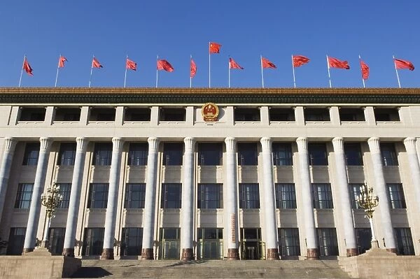 Chinese national flags on a government building Tiananmen Square Beijing China