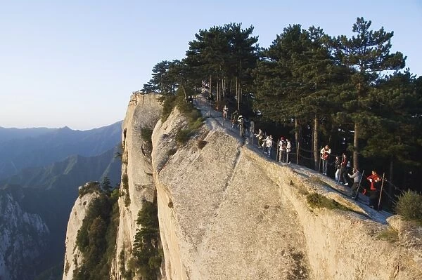 Chinese people waiting for sunrise on top of Hua Shan, a granite peaked mountain