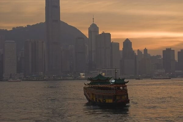 A Chinese style tourist boat sails in Victoria Harbour, Hong Kong, China, Asia