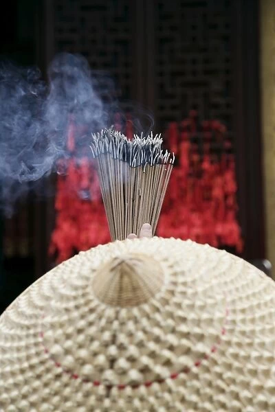 Chinese woman with incense sticks, Jade Buddha Temple, Shanghai, China, Asia