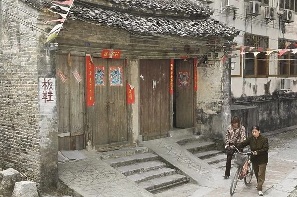 Chinese women walking in street, Xingping, Guangxi Province, China, Asia