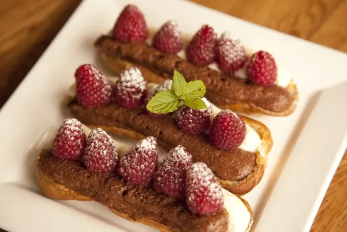 Framed Print : Chocolate eclairs topped with raspberries, French cafe, France, Europe Framed Print : Chocolate eclairs topped with raspberries, French cafe, France, Europe