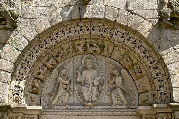 Christ in Majesty between two angels in Main porch of St. Sauveur Basilica built between the 12th and 15th centuries, Tomb of the heart of Dugesclin, Dinan, Brittany, France, Europe