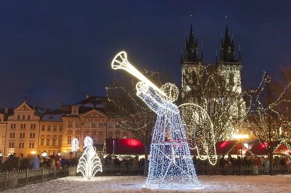 Christmas decorations at Christmas Market and Gothic Tyn Church, Old Town Square, Prague, Czech Republic, Europe