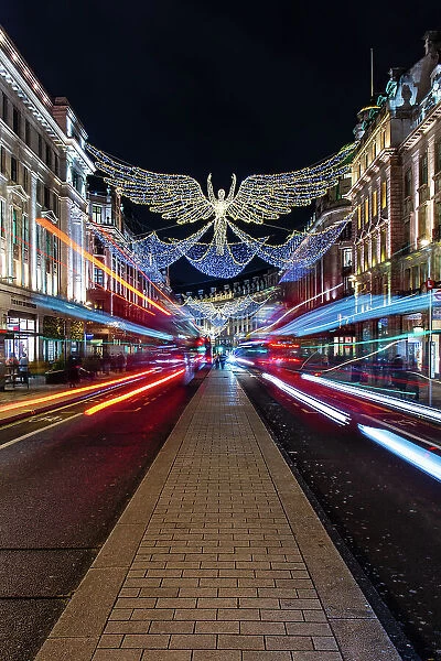 Christmas decorations in Regent Street with light trails, London, England, United Kingdom, Europe