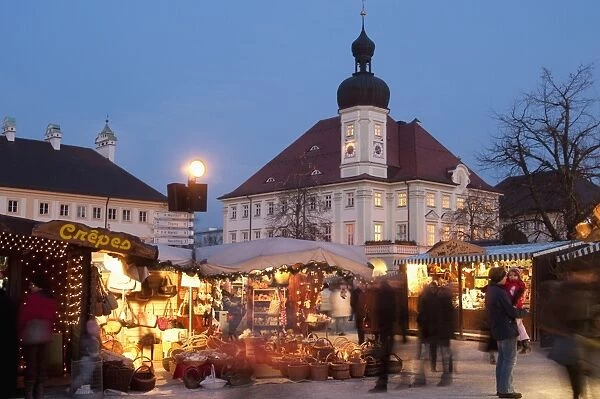 Christmas Market (Christkindlmarkt) stalls and Town Hall, Kapellplatz, at twilight