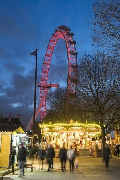 Christmas Market in Jubilee Gardens, with The London Eye at night, South Bank, London