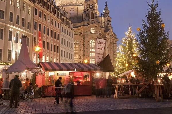Christmas Market stalls in front of Frauen Church and Christmas tree at twilight