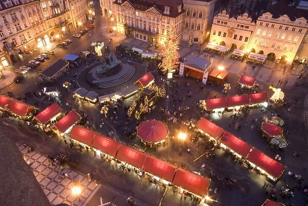 Christmas market at Staromestske (Old Town Square) with statue of Jan Hus