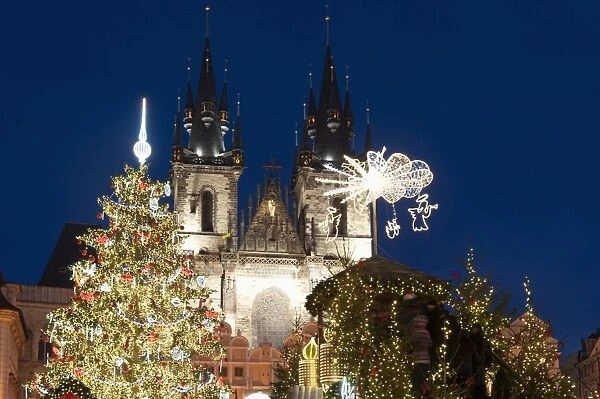 Christmas Tree and decorations in front of Tyn Gothic Church, Old Town Square, UNESCO World Heritage Site, Prague, Czech Republic, Europe