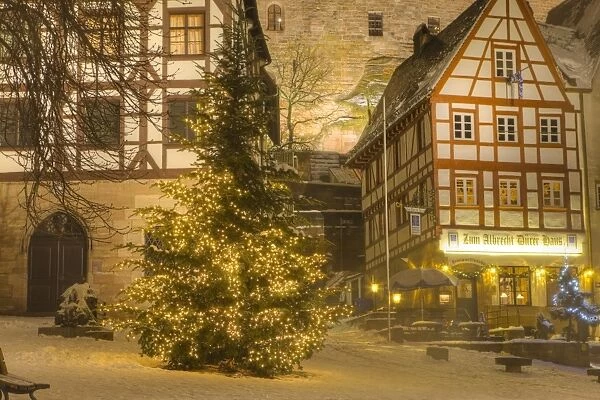 Christmas Tree lit up at night in the historic center of Nuremberg, Germany, Europe