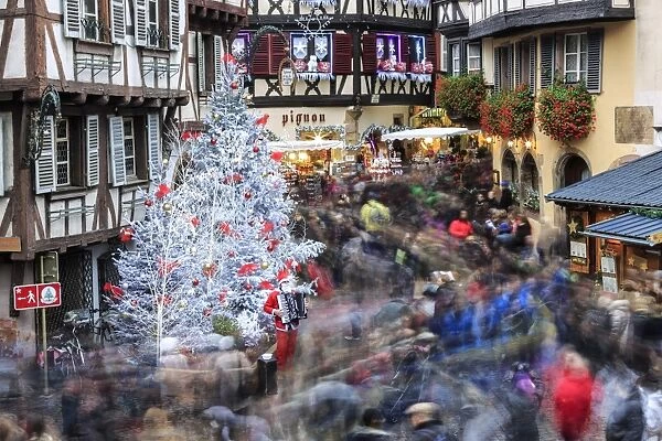 Christmas tree and Santa Claus in the pedestrian roads of the old town, Colmar, Haut-Rhin