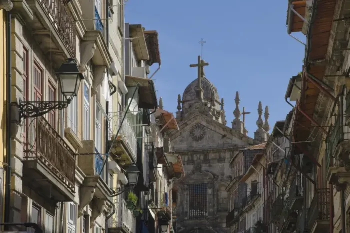 Framed Print : A church dominates a narrow street in the old town, Oporto, Portugal, Europe Framed Print : A church dominates a narrow street in the old town, Oporto, Portugal, Europe