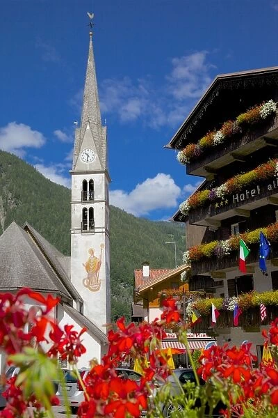 Church and hotel, Alleghe, Belluno Province, Italian Dolomites, Italy, Europe