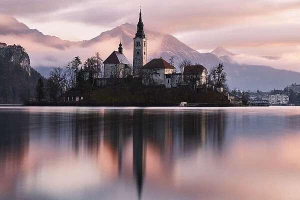 A church in the island in the middle of Bled lake at sunrise, Slovenia, Europe