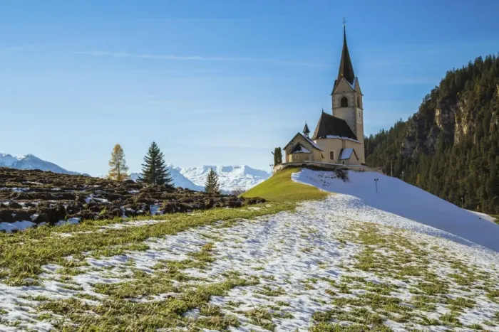 Framed Print : The church of the little village of Schmitten surrounded by snow, Albula District Framed Print : The church of the little village of Schmitten surrounded by snow, Albula District