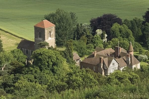 Church and manor house, Little Malvern, viewed from main ridge of the Malvern Hills