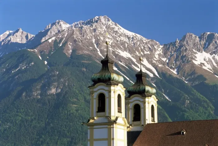 Framed Print : Church with mountain backdrop, Innsbruck, Tirol (Tyrol), Austria, Europe Framed Print : Church with mountain backdrop, Innsbruck, Tirol (Tyrol), Austria, Europe