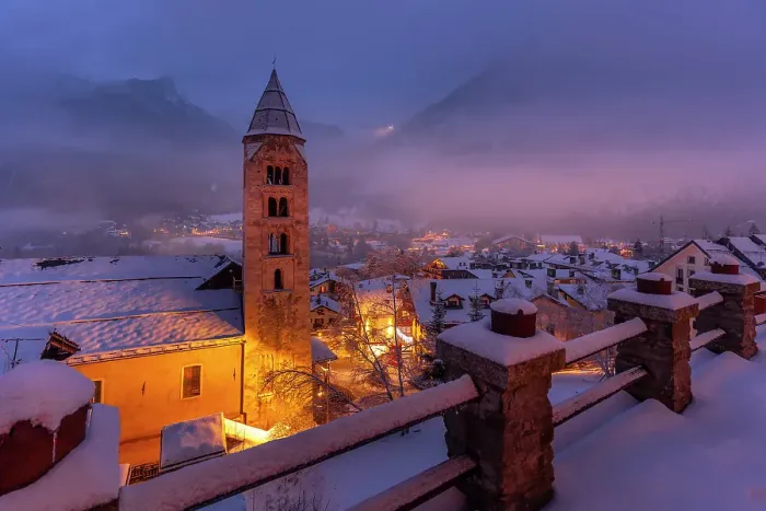 Framed Print : Church of Saint Pantalon and snow covered town centre and mountainous background in winter at dusk, Courmayeur, Aosta Valley, Italian Alps, Italy Framed Print : Church of Saint Pantalon and snow covered town centre and mountainous background in winter at dusk, Courmayeur, Aosta Valley, Italian Alps, Italy