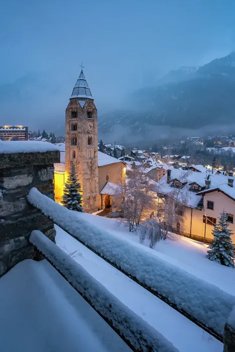 Framed Print : Church of Saint Pantalon, snow covered town centre and mountainous background in winter at dusk, Courmayeur, Aosta Valley, Italian Alps, Italy Framed Print : Church of Saint Pantalon, snow covered town centre and mountainous background in winter at dusk, Courmayeur, Aosta Valley, Italian Alps, Italy