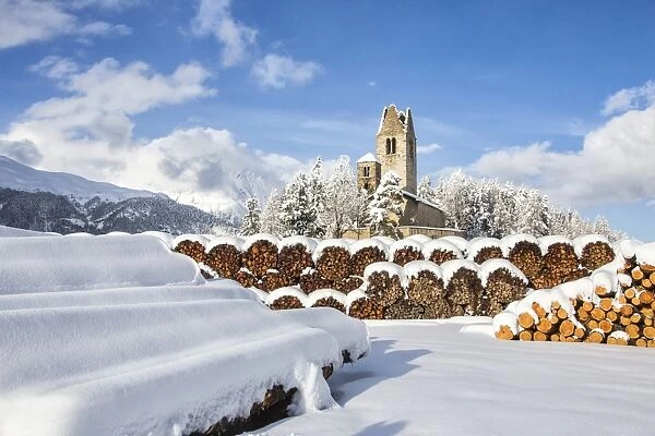 The church of San Gian surrounded by snowy woods, Celerina, Engadine, Canton of Grisons
