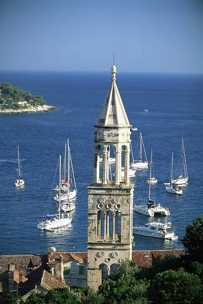 Church spire and boats in the harbour, Hvar Town, Hvar Island, Dalmatia