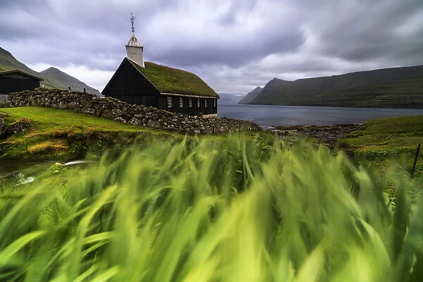 Church with traditional grass roof oceanfront, Funningur, Eysturoy island, Faroe Islands