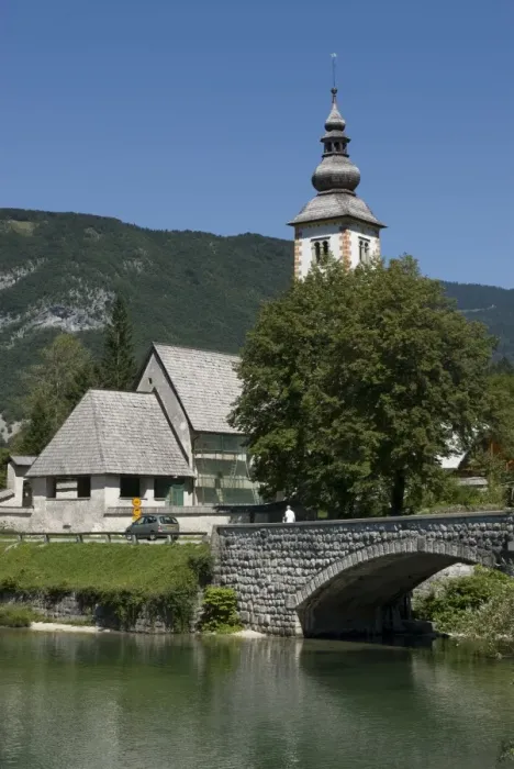 Framed Print : Church in village, bridge over Bohinj Lake, Slovenia, Europe Framed Print : Church in village, bridge over Bohinj Lake, Slovenia, Europe
