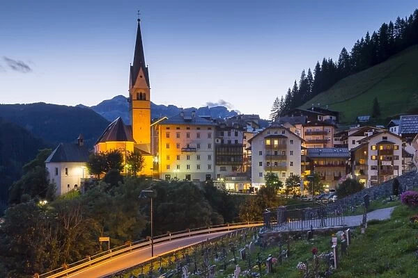 Church and village of Pieve Di Livinallongo at dusk, Province of Belluno, Dolomites