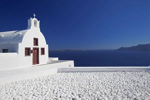 Church and white stones at Oia, Santorini, Cyclades, Greek Islands, Greece, Europe