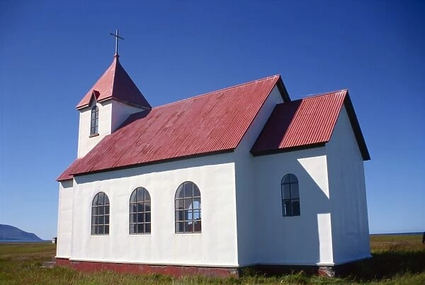 Church with white walls and corrugated roof at Flatey