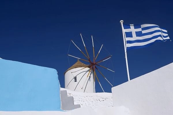 Church, windmill and Greek flag, Santorini, Cyclades, Greek Islands, Greece, Europe