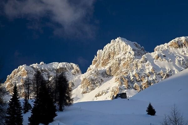 Cima dell Uomo snow peak at sunset, San Pellegrino pass, Dolomites