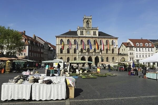 The City Hall (Rathaus) and market stalls on the cobbled Market Place (Marktplatz) in Weimar