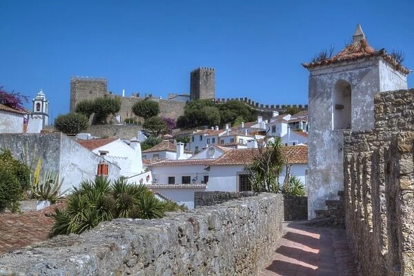 City overview with Wall and Medieval Castle in the background, Obidos, Portugal, Europe