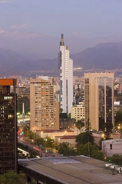 City skyline and the Andes mountains at dusk, Santiago, Chile, South America