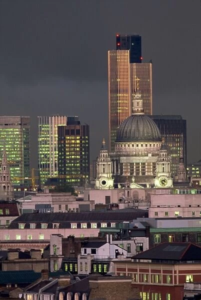 City skyline illuminated at night, including St. Pauls Cathedral and the NatWest Tower