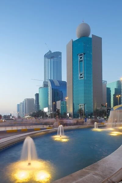 City skyline on Rashid Bin Saeed Al Maktoum Street at dusk, Abu Dhabi, United Arab Emirates, Middle East