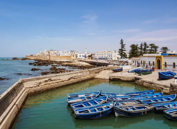 Framed Print : Cityscape with blue boats in the Scala Harbour and the Medina city walls, Essaouira Framed Print : Cityscape with blue boats in the Scala Harbour and the Medina city walls, Essaouira